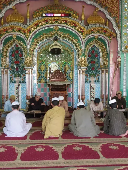 Pakistani students at a madrassa, or Islamic school, in the city of Haripur recite aloud from the Quran in hopes of memorizing the entire holy book. Image by Beenish Ahmed. Pakistan, 2013. Media file: img_2579.jpg