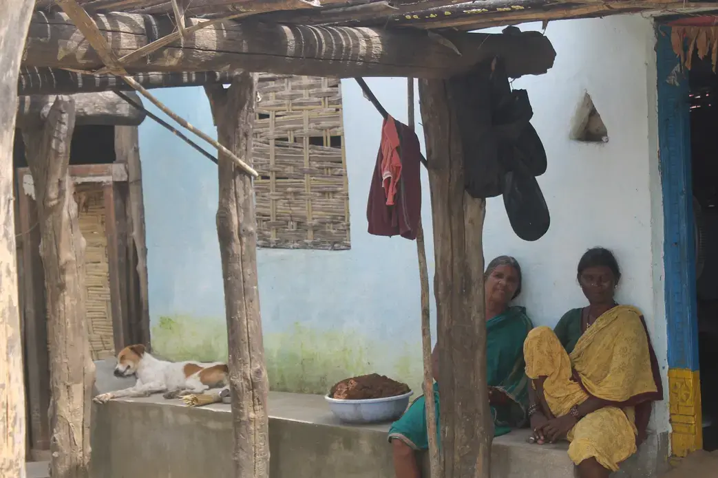 Women from the Naikpod tribe rest at their homes in the forests of Kawal Tiger Sanctuary. Image by Vandana Menon. India, 2019.
