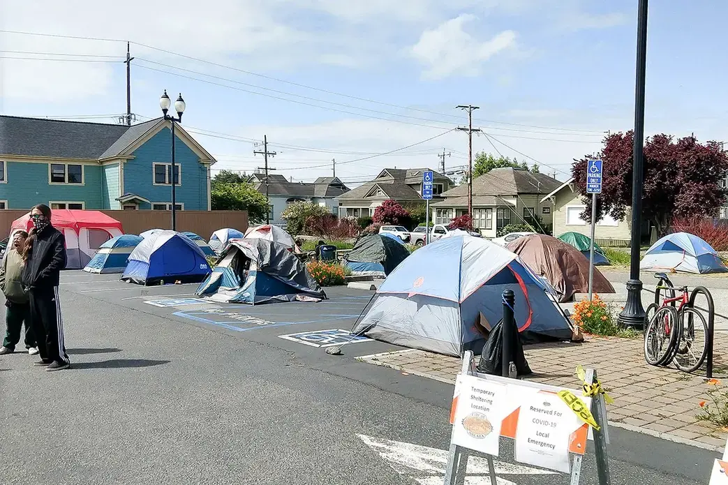 The emergency tent shelter in Arcata, California, shown here on April 19, helps unsheltered homeless people gain access to medical and other services during the COVID-19 pandemic. Image courtesy of Arcata House Partnership. United States, 2020. The emergency tent shelter in Arcata, California, shown here on April 19, helps unsheltered homeless people gain access to medical and other services during the COVID-19 pandemic. Image courtesy of Arcata House Partnership. United States, 2020.