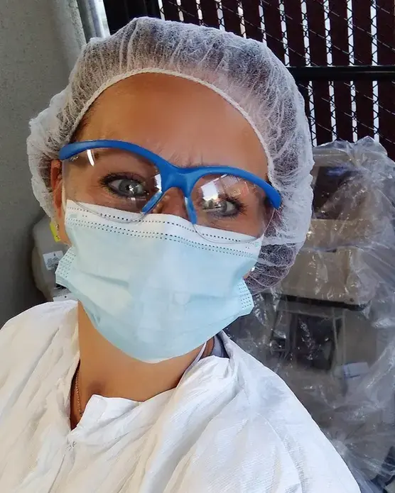 Tiffany Cordaway, 47, as seen in this April 23 selfie, was working two jobs and living in a friend’s car at the start of the pandemic. For her day job, she wears protective gear while disinfecting medical equipment, including some used on COVID-19 patients. At night, she cares for the elderly. Image courtesy of Tiffany Cordaway. United States, 2020.