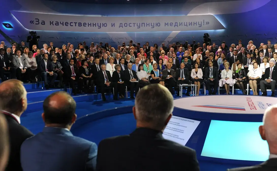 Vladimir Putin took part in the plenary session of the Russian Popular Front public movement’s forum For Quality and Affordable Medicine. Image courtesy by the Official Internet Resources of the President of Russia. Russia, 2015. Media file: 00.jpg