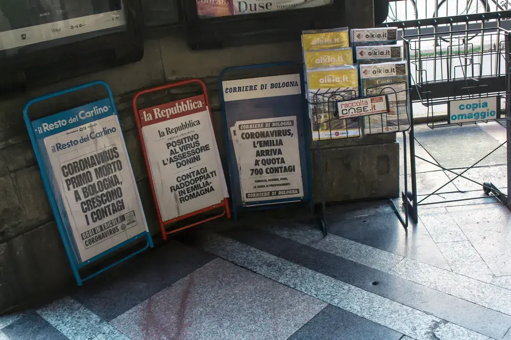 Newsstands in Bologna, Italy show headlines referring to the COVID-19 pandemic. Image by Angela M. Benivegna. Italy, 2020. Newsstands in Bologna, Italy show headlines referring to the COVID-19 pandemic. Image by Angela M. Benivegna. Italy, 2020.