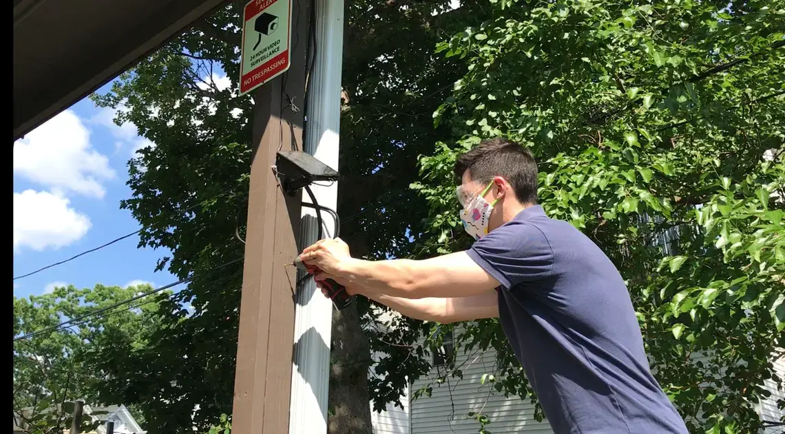 Doug Quattrochi, pictured installing solar panels, runs MassLandlords.net, the largest nonprofit for owners and managers of Massachusetts residential real estate. Image courtesy of Doug Quattrochi. United States, 2020.