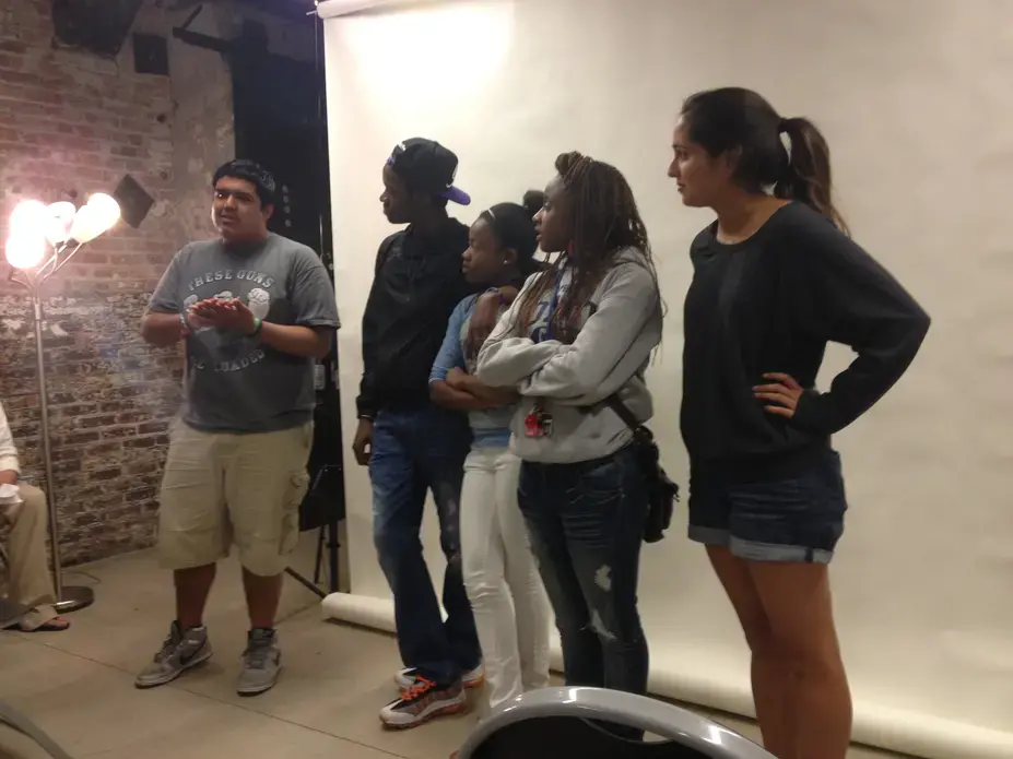 The team that produced "I Am Happy," a short documentary on teen suicide in Chicago, presents their work alongside their mentor, Meghan Dhaliwal. Photo by Amanda Ottaway. Chicago, 2013. Media file: img_2764.jpg