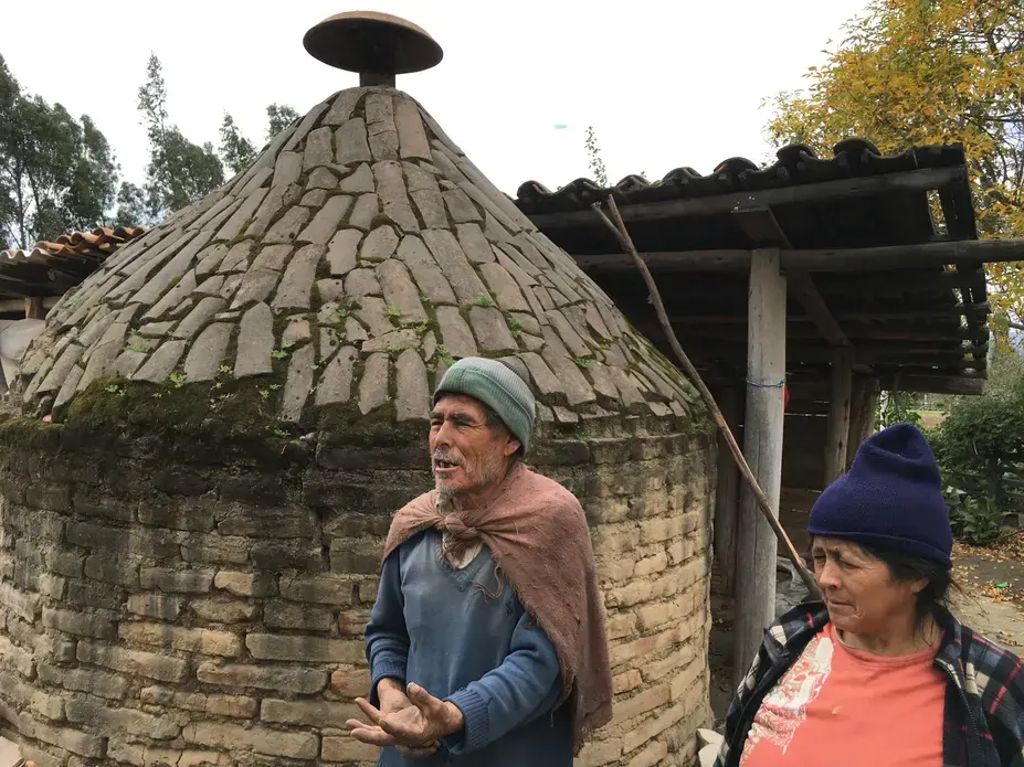 Domingo Gabriel Bastidas, 67, and his wife, Maria Pruno Bastidas, 58, describe the ceramic kiln in their backyard and discuss the business of tile making, including its important web of social, economic, and health effects in La Victoria. Image by Caitlin Cotter. Ecuador, 2016. Media file: domingo_and_maria.jpg