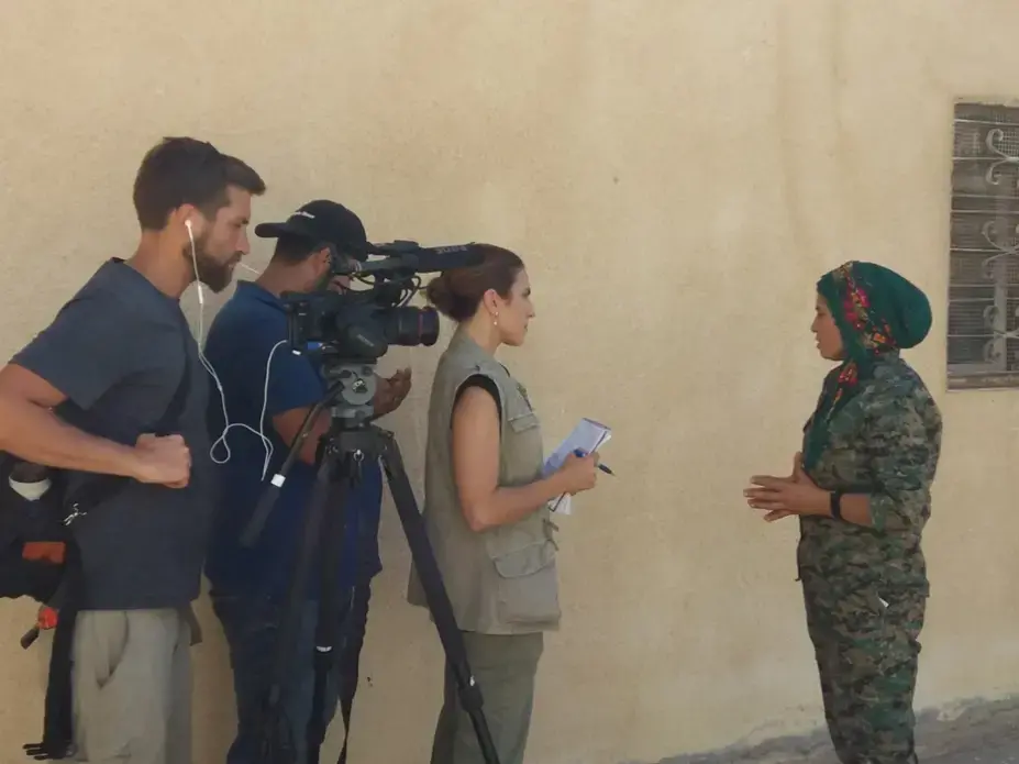 Interviewing Klara, one of the commanders of the Raqqa campaign against ISIS. Image by Jon Gerberg/PBS NewsHour. Syria, 2017. Interviewing Klara, one of the commanders of the Raqqa campaign against ISIS. Image by Jon Gerberg/PBS NewsHour. Syria, 2017.