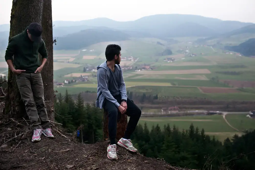 Rafat and Naif on the overlook in the Black Forest near Zell am Hammersbach, Germany. Image by Holly Pickett. Germany, 2014. Rafat and Naif on the overlook in the Black Forest near Zell am Hammersbach, Germany. Image by Holly Pickett. Germany, 2014.
