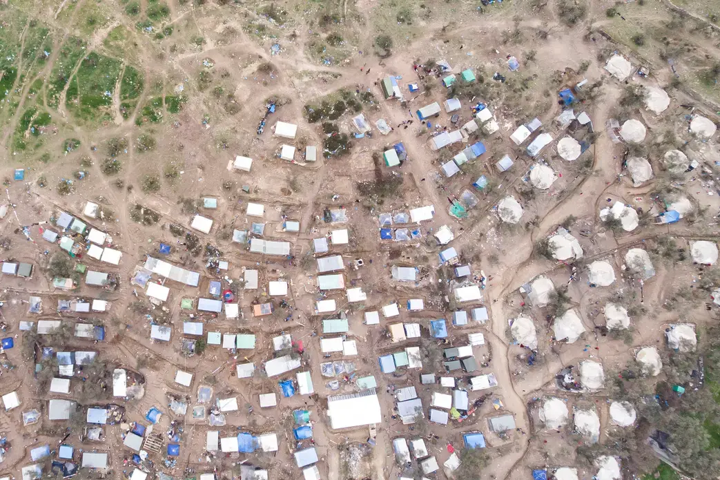Aerial view of Moria Refugee camp and makeshift settlement around it. Image by Nicolas Economou / Shutterstock. Greece, 2020. Aerial view of Moria Refugee camp and makeshift settlement around it. Image by Nicolas Economou / Shutterstock. Greece, 2020.