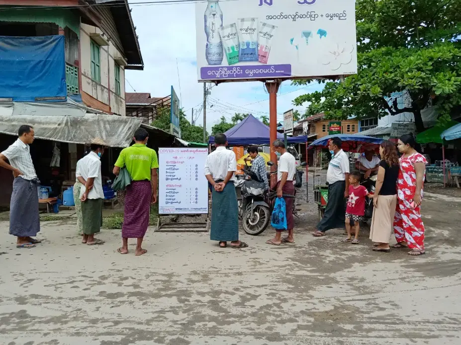 Residents of the town of Mrauk-U in Rakhine State, Myanmar gather around a COVID-19 information board created by a local civil society organization. Following a 14-month block on all internet services, the Myanmar government restored 2G services in August but continues to block 3G and 4G networks in eight conflict-affected townships, including Mrauk-U. Myanmar, 2020. Residents of the town of Mrauk-U in Rakhine State, Myanmar gather around a COVID-19 information board created by a local civil society organization. Following a 14-month block on all internet services, the Myanmar government restored 2G services in August but continues to block 3G and 4G networks in eight conflict-affected townships, including Mrauk-U. Myanmar, 2020.