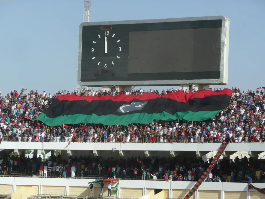 Football fans celebrate Libya’s first international football match after the revolution. Image by Nicolas Pelham. Libya, 2013. Media file: p1160808_-_script4_football_fans.jpg