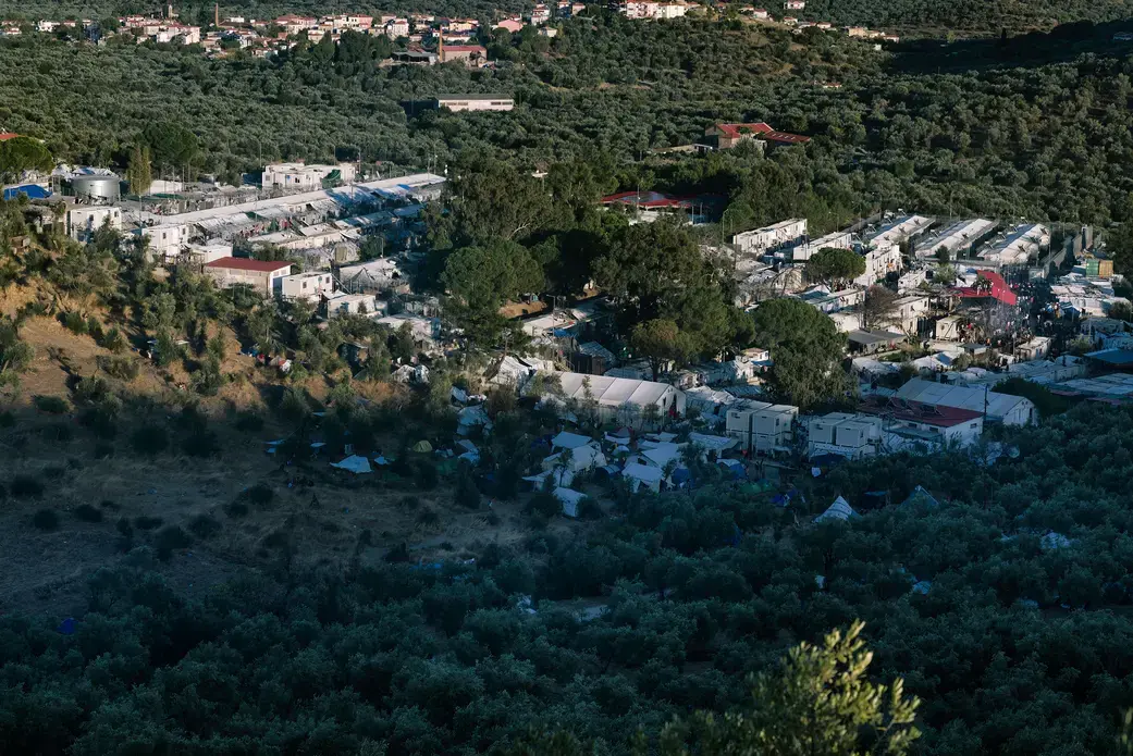 A view of the Moria refugee camp in September 2019. Thousands have been left homeless after a fire destroyed the camp. Image by Aleksandra H. Kossowska / Shutterstock. Greece, 2019. A view of the Moria refugee camp in September 2019. Thousands have been left homeless after a fire destroyed the camp. Image by Aleksandra H. Kossowska / Shutterstock. Greece, 2019.