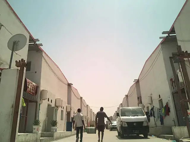 Workers cannot afford to pay for taxis to go outside the labor camp which is about 9 miles from the Doha city center. Most days they just stay inside the camp. Image by Ana P. Santos. Qatar, 2017.