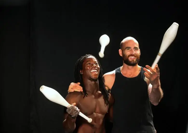 Acrobats Yamoussa Bangoura and Guillaume Saladin perform at the Emerson College 'Circus Without Borders' screening. Image by Michele McDonald. Massachusetts, 2015.