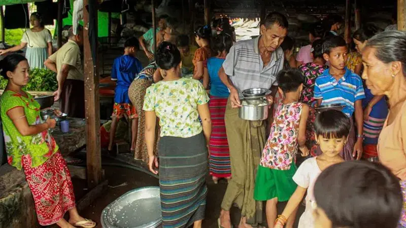Internally displaced persons (IDPs) cook at a camp in Rakhine State last week. With social distancing nearly impossible, IDPs are at risk of contracting the coronavirus. Myanmar, 2020. Internally displaced persons (IDPs) cook at a camp in Rakhine State last week. With social distancing nearly impossible, IDPs are at risk of contracting the coronavirus. Myanmar, 2020.