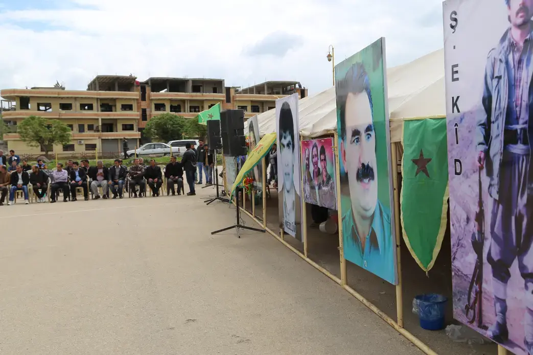 YPG soldiers and civilians attend a funeral in Derik. Image by Omar Abdulkhader. Syria, 2015. Media file: img_6991.jpg