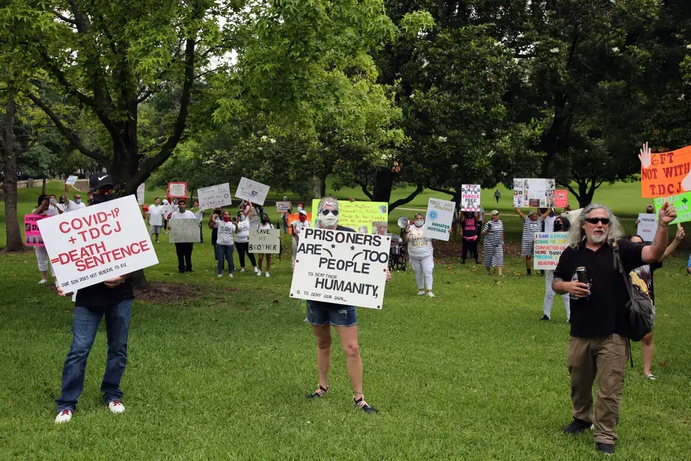 Family members of prisoners held in Texas' state prison system demonstrate at the Governor's Mansion in Austin for their release on parole due to the danger of COVID-19 in prisons. Image by Vic Hinterlang / Shutterstock. United States, 2020. Family members of prisoners held in Texas' state prison system demonstrate at the Governor's Mansion in Austin for their release on parole due to the danger of COVID-19 in prisons. Image by Vic Hinterlang / Shutterstock. United States, 2020.