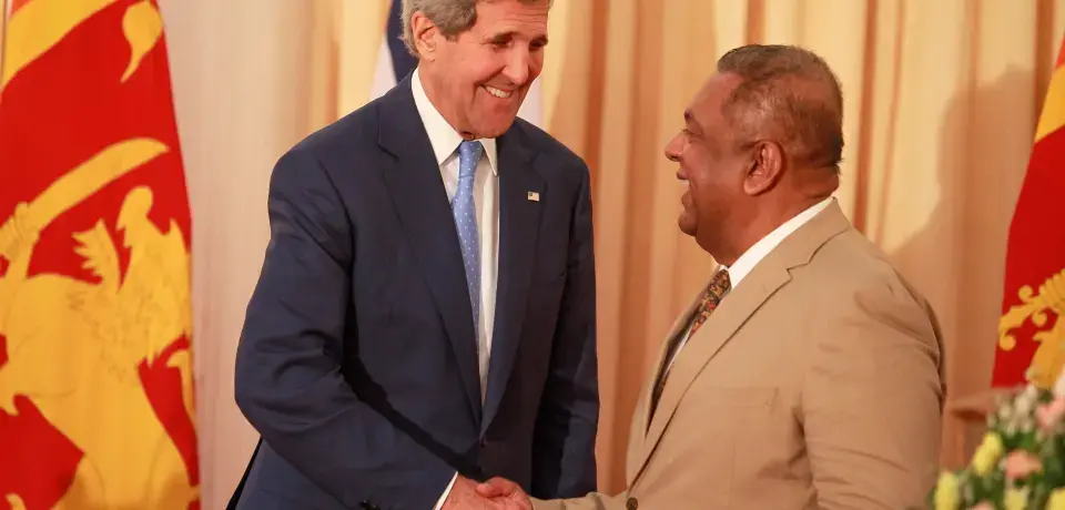 U.S. Secretary of State John Kerry, left, shakes hands with Sri Lankan Foreign Minister Mangala Samaraweera during a news conference following a meeting at the Ministry of Foreign Affairs in Colombo. Image by Chamila Karunarathne/Anadolu Agency/Getty Images. Sri Lanka, 2015. Media file: 471908402.jpg