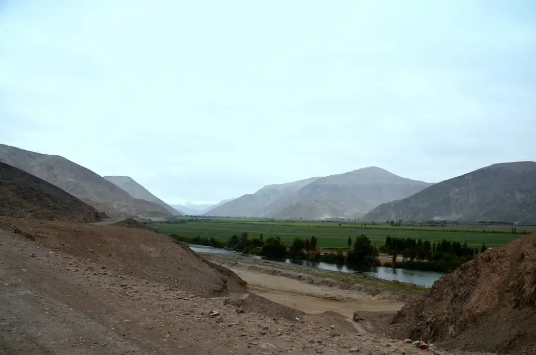 This farm valley in southern Peru, just above the border with Chile, is threatened by the first mine ever proposed for a region—an open pit copper mine that protesters have stalled since 2009. Image by Justin Catanoso. Peru, 2015. Media file: farm_valley_near_mine_site.jpg