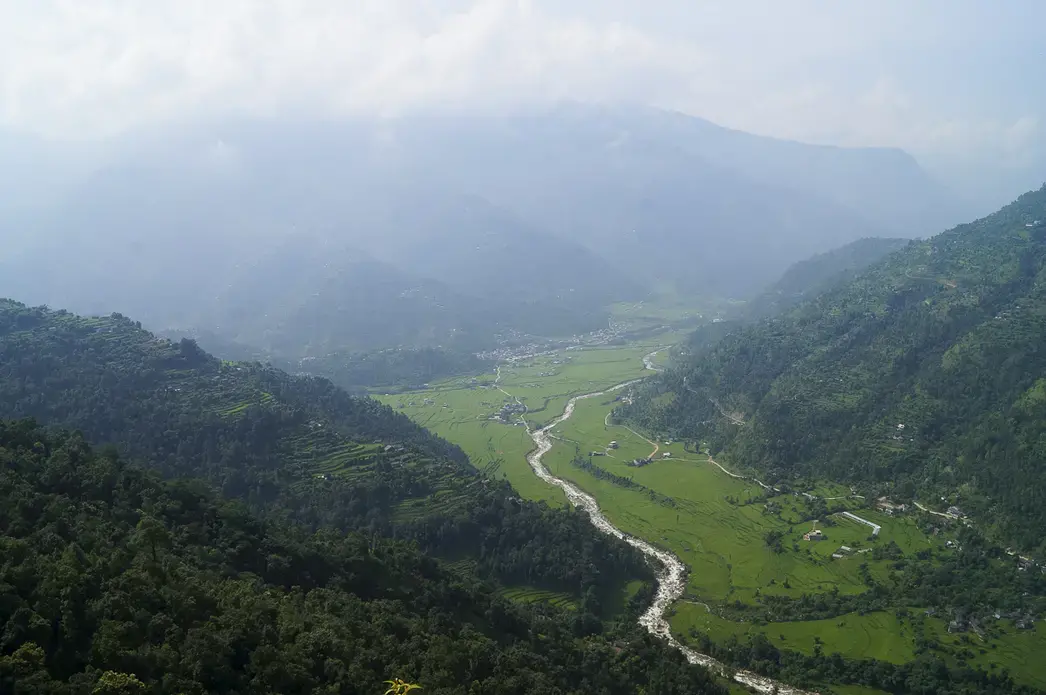 Giri Prasad B.K. hasn't been home to Baglung district, which includes lush, green river valleys, since he left Qatar for the second time in 2007. Giri Prasad B.K.'s wife and 9-year-old daughter live in their home in rural Baglung district, located west of Kathmandu. Image by Yam Kumari Kandel. Nepal, 2016.