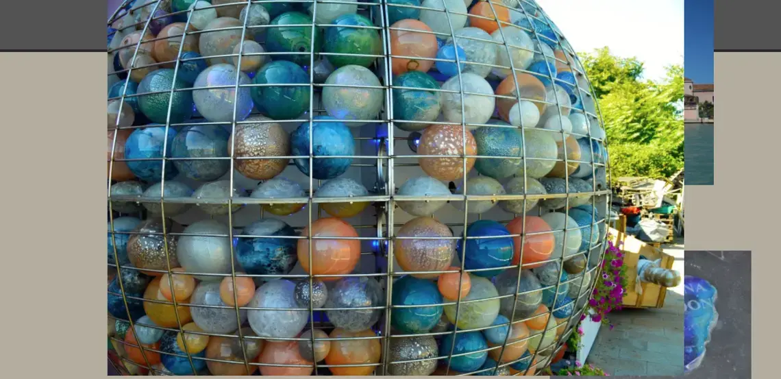 The famous “Full Moon” designed by Judi Harvest adorns the fondamenta outside the Giuman glass factory on Sacca Serenella. Image by Robert Eric Shoemaker. Italy, 2014. Media file: capture_from_slideshow.png