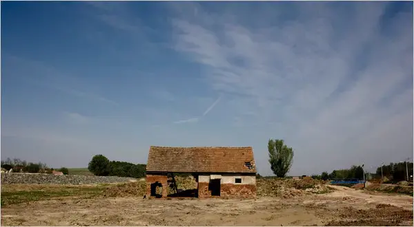 A house lay in ruins just meters from the Ajka Alumina plant. The house will remain as a memorial to the environmental disaster. Image by Nadia Shira Cohen. Hungary, 2011. image