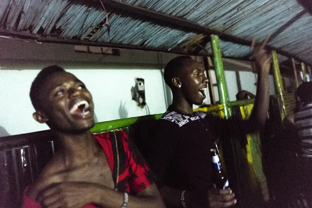 Javan dances with friends at Ram, a bar in Kampala which hosted LGBTQ nights on Sundays and had become the de facto gay bar in the city. It closed a few months ago, leaving the city without any bars with openly LGBTQ nights. Image by Jake Naughton. Uganda, 2017.