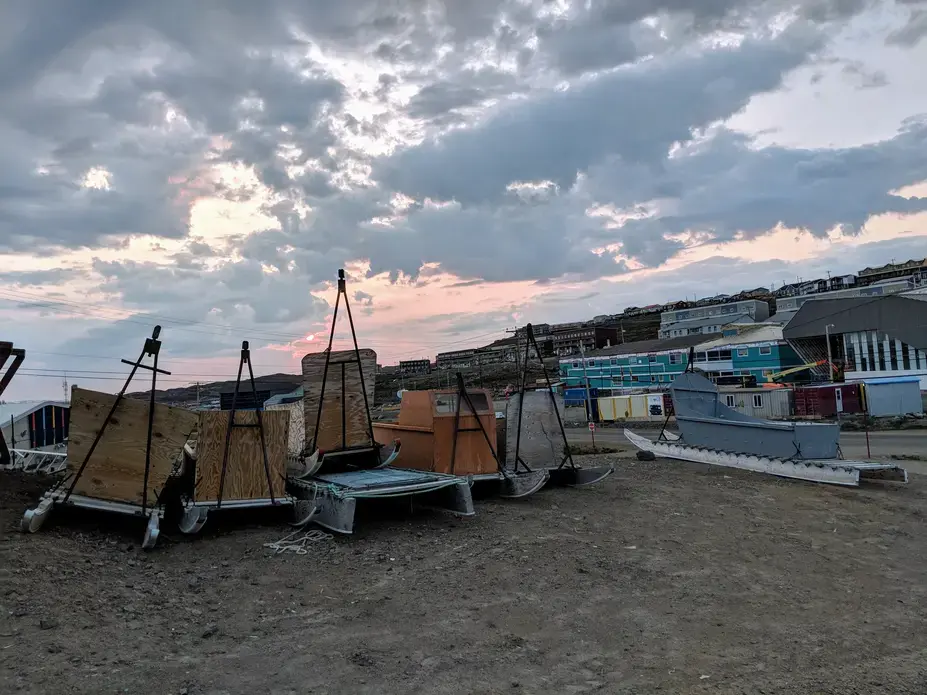 Qamutiks (Inuit sleds) lined up outside Iqaluit’s high school. Image by Julie De Meulemeester. Canada, 2018. Qamutiks (Inuit sleds) lined up outside Iqaluit’s high school. Image by Julie De Meulemeester. Canada, 2018.