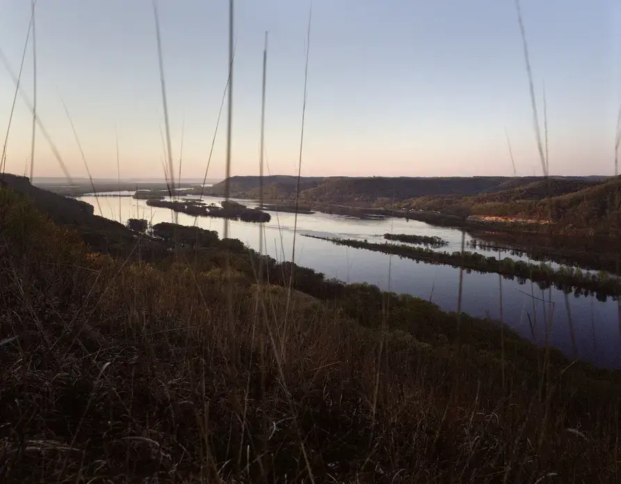 Trempealeau, Wisconsin - The Mississippi River. Agricultural fertilizer from 31 states wash into the Mississippi River. Like a topologic funnel it directs 41% of America’s water toward the delta, and America’s most productive fishing grounds. Image by Spike Johnson. United States, 2019. 
