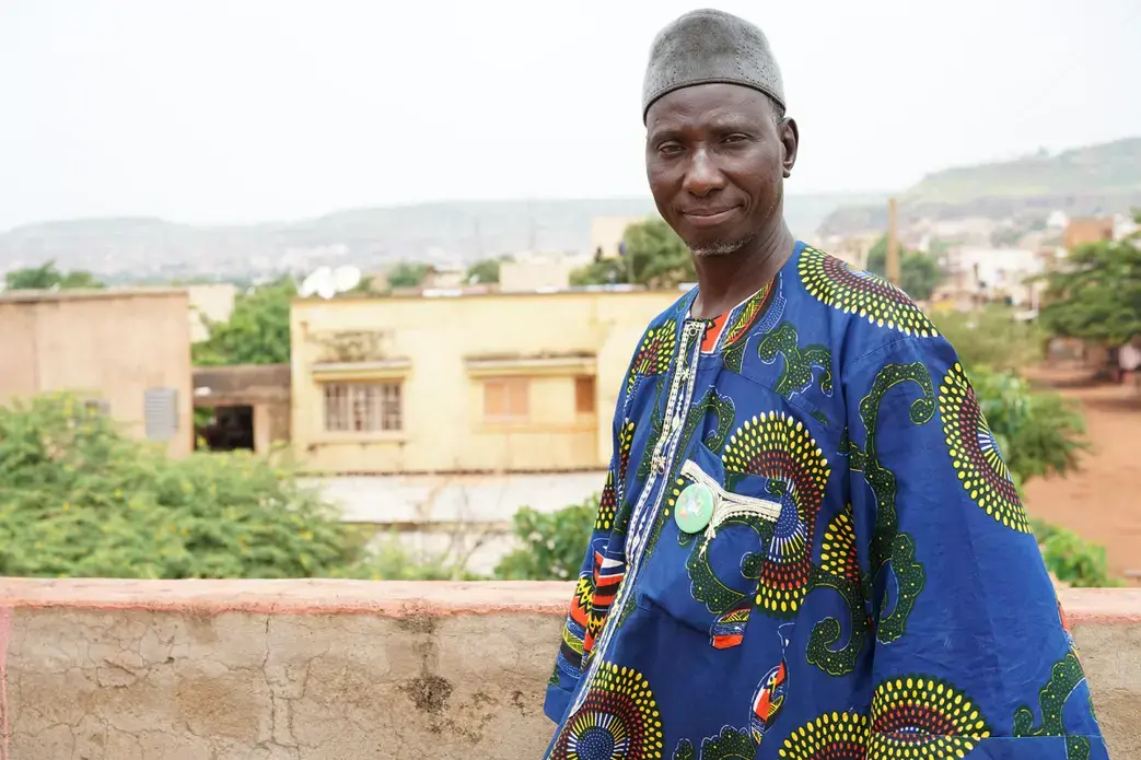 Amadou Coulibaly outside his office at the Malian Association for Deportees in Bamako, Mali. Image by Sébastien Rieussec/Foreign Policy. Mali, 2017. Amadou Coulibaly outside his office at the Malian Association for Deportees in Bamako, Mali. Image by Sébastien Rieussec/Foreign Policy. Mali, 2017.