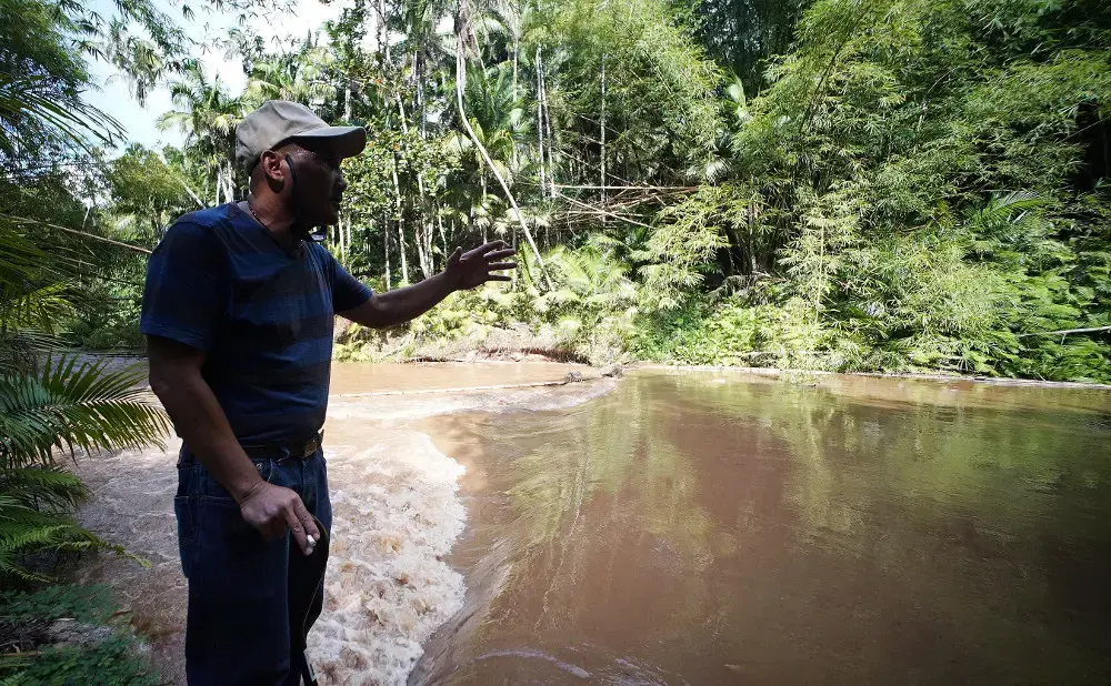 B.J. says the river was calmer the day that Fr. Louis Brouillard tied him to a tree and raped him three times. He says he was bleeding and didn't understand what was happening. Image by Cory Lum. Guam, 2017. B.J. says the river was calmer the day that Fr. Louis Brouillard tied him to a tree and raped him three times. He says he was bleeding and didn't understand what was happening. Image by Cory Lum. Guam, 2017.