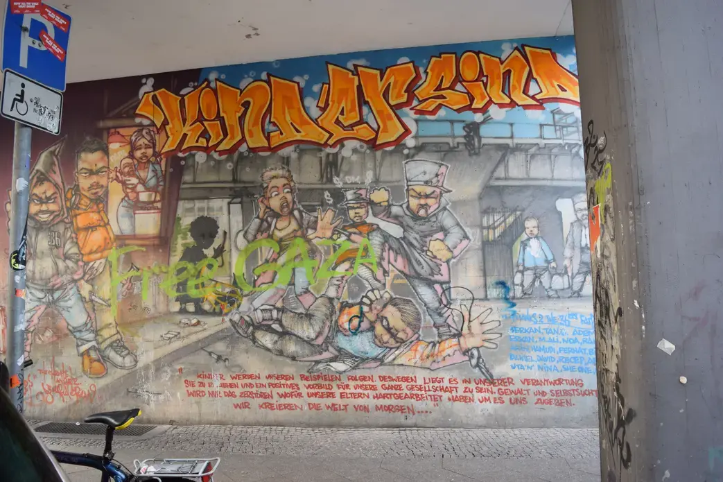 A mural in Kreuzberg, the borough known as “Little Istanbul,” depicts the struggling youth culture of Berlin’s Turkish Community. The mural reads:
“Children follow our examples. Because of this, it’s our responsibility to educate them as to how to be positive role models for our entire community. Violence and egoism will only destroy that for which our parents have worked so hard to give us. We’ll create the world of tomorrow.” Image by Austin Davis. Germany, 2015. Image by Austin Davis. Germany, 2015.