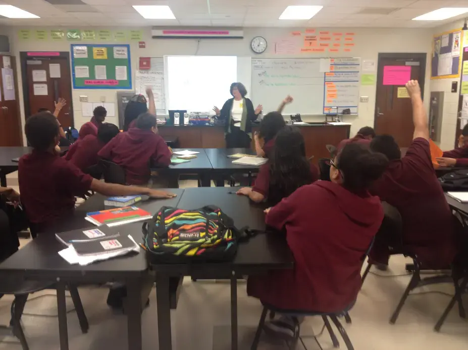 Joanne Silberner speaks with seventh-grade students at Lincoln Middle School, Columbia Heights Education Campus, during her tour of DC schools Friday, October 11. Image by Amanda Ottaway. Washington DC, 2013. Media file: silbernerschool.jpg