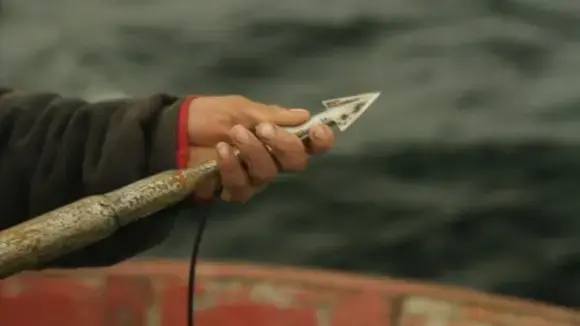 The captain preparing his harpoon for hunting. Image by Jim Wickens/Ecostorm/ITV News. Peru, 2013. Media file: wickens1.jpg