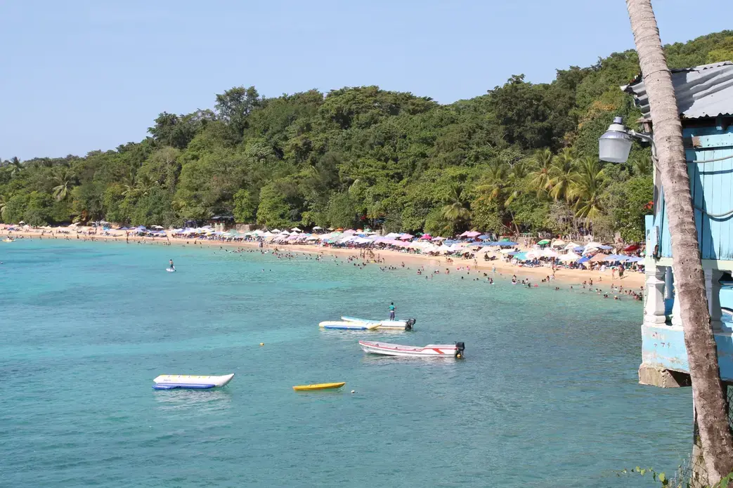 Lined with restaurants and shops, the beach in Sosua, Dominican Republic, is frequented by locals and foreigners. Image by Emily Codik. Dominican Republic, 2017.