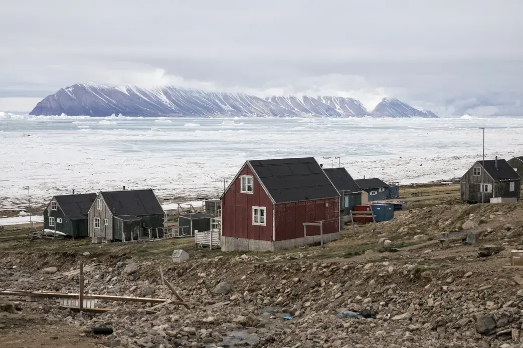 Many of the residents in Qaanaaq live in permafrost areas, and their homes are built on frozen ground. As the permafrost thaws, the ground becomes weaker and less able to support these structures, and it becomes dangerous to live inside. In parts of North Greenland, coastlines and soil are being eroded as storms batter the land and the permafrost crumbles. Image by Anna Filipova. Greenland, 2018.