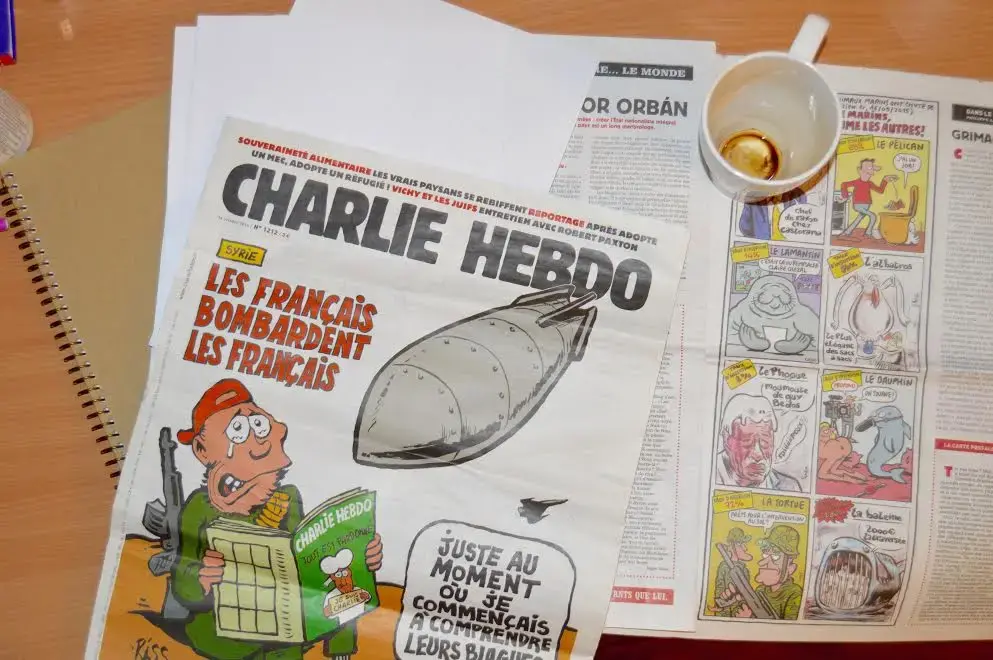 The attacks on Charlie Hebdo prompted extensive conversation about the right to freedom of speech and where defamation fits into the picture. Some question whether conversations like these also increased openness to discussing religion in French schools. Image by Charlotte Bellomy. France, 2015. Media file: charlie_hebdo.jpg