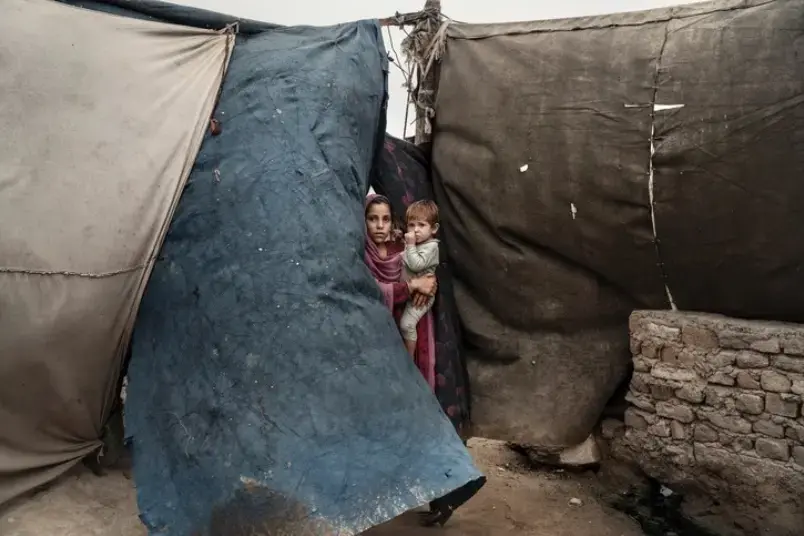 Children living in an encampment, in Jalalabad, after fleeing violence between isis and the Taliban. There are now two and a half million internally displaced Afghans. Image by Adam Ferguson. Afghanistan, 2019. Children living in an encampment, in Jalalabad, after fleeing violence between isis and the Taliban. There are now two and a half million internally displaced Afghans. Image by Adam Ferguson. Afghanistan, 2019.