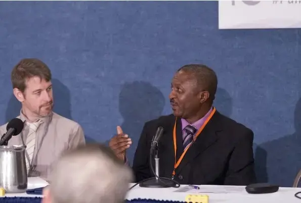 Filmmaker and Pulitzer Center grantee Rob Tinworth (left) listens as Uche Onyebadi discusses Campus Consortium program during a panel at the Pulitzer Center's 10th Anniversary Celebration, held in Washington, DC, on October 8, 2016. Onyebadi is chair of the Department of Journalism at Texas Christian University’s Bob Schieffer College of Communication. Image by Jin Ding. Washington, D.C., 2016 Media file: rob_and_uche.jpg