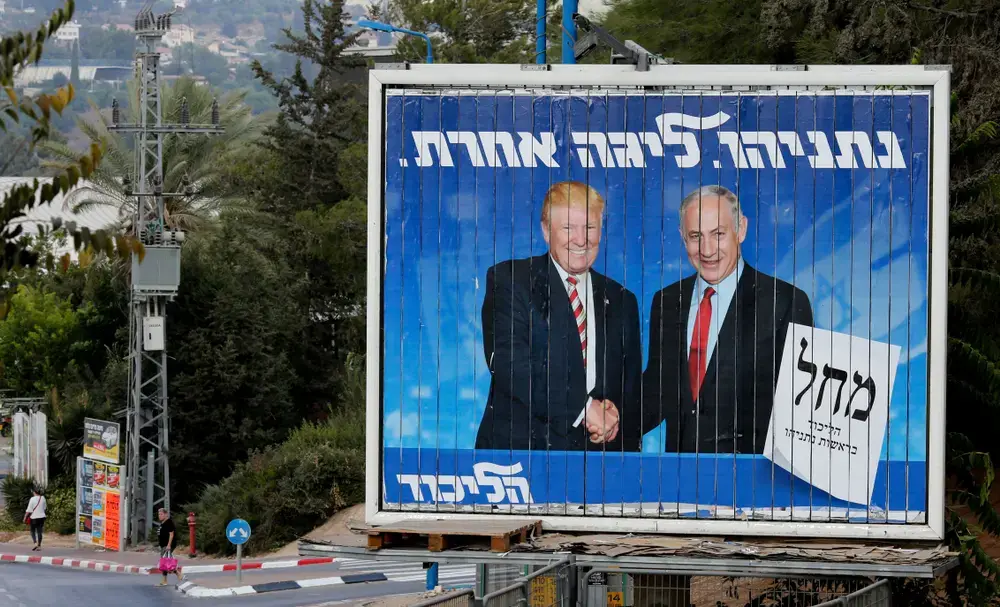 An Israeli election billboard for the Likud party showing President Donald Trump shaking hands with Israeli Prime Minister Benjamin Netanyahu in Beth Shemesh, Israel on September 8, 2019. Image by Gil Cohen Magen / Shutterstock. Israel, 2019. An Israeli election billboard for the Likud party showing President Donald Trump shaking hands with Israeli Prime Minister Benjamin Netanyahu in Beth Shemesh, Israel on September 8, 2019. Image by Gil Cohen Magen / Shutterstock. Israel, 2019.