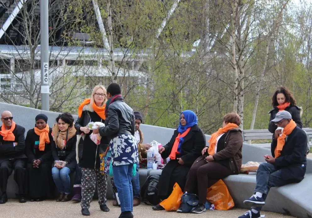 Before the rally, Migrants Organise, an organization that helps immigrants in all kinds of circumstances in London, had a picnic with food, music and dancing—sharing a message of welcome for all migrants in Olympic Park. Image by Abe Kenmore. United Kingdom, 2016.