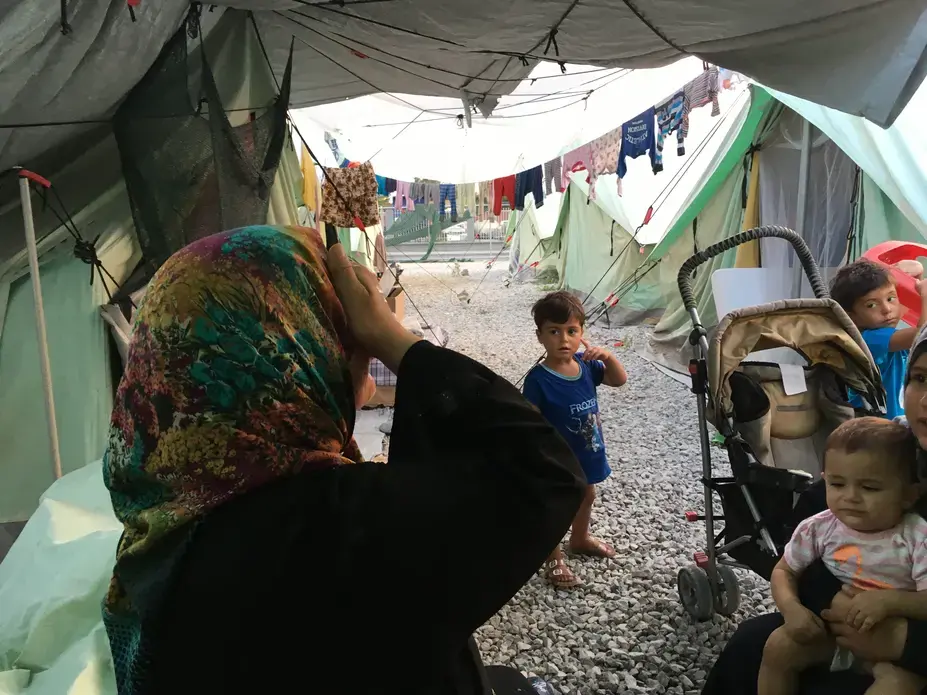 A woman and her children at Softex refugee camp in northern Greece. Image by Jeanne Carstensen. Greece, 2016. A woman and her children at Softex refugee camp in northern Greece. Image by Jeanne Carstensen. Greece, 2016.