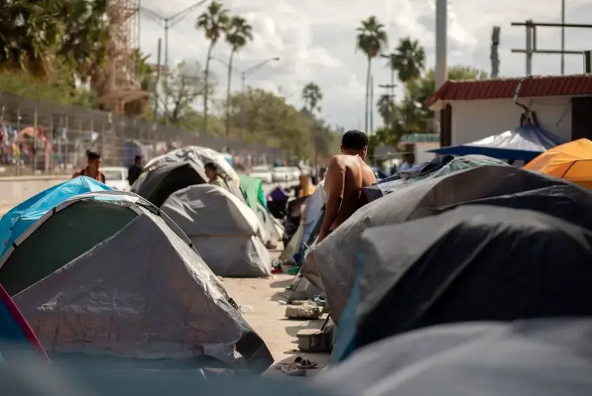 Rows of tents are clustered near the Gateway International Bridge in Matamoros, Mexico. Image by Miguel Gutierrez Jr. Mexico, 2019. Rows of tents are clustered near the Gateway International Bridge in Matamoros, Mexico. Image by Miguel Gutierrez Jr. Mexico, 2019.