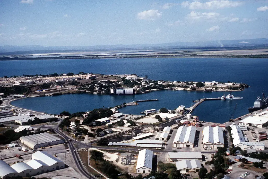 Aerial view of the Guantanamo Bay Naval Base. Image by Everett Collection / Shutterstock. United States, 1995. Aerial view of the Guantanamo Bay Naval Base. Image by Everett Collection / Shutterstock. United States, 1995.