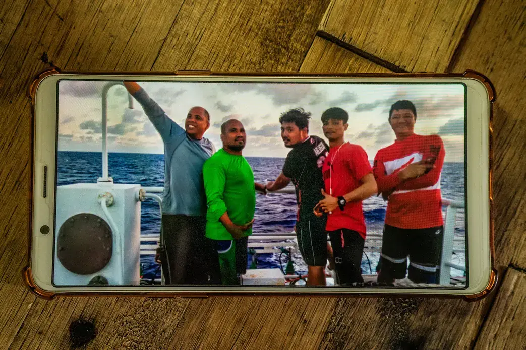 SEAFARERS. Jesus Gaboni (leftmost), with other Filipino crew aboard their fishing vessel. The man on the rightmost, Raul Calopez, got sick onboard and eventually died. Gaboni helped store Calopez's body in the ship's freezer. Image by Martin San Diego.