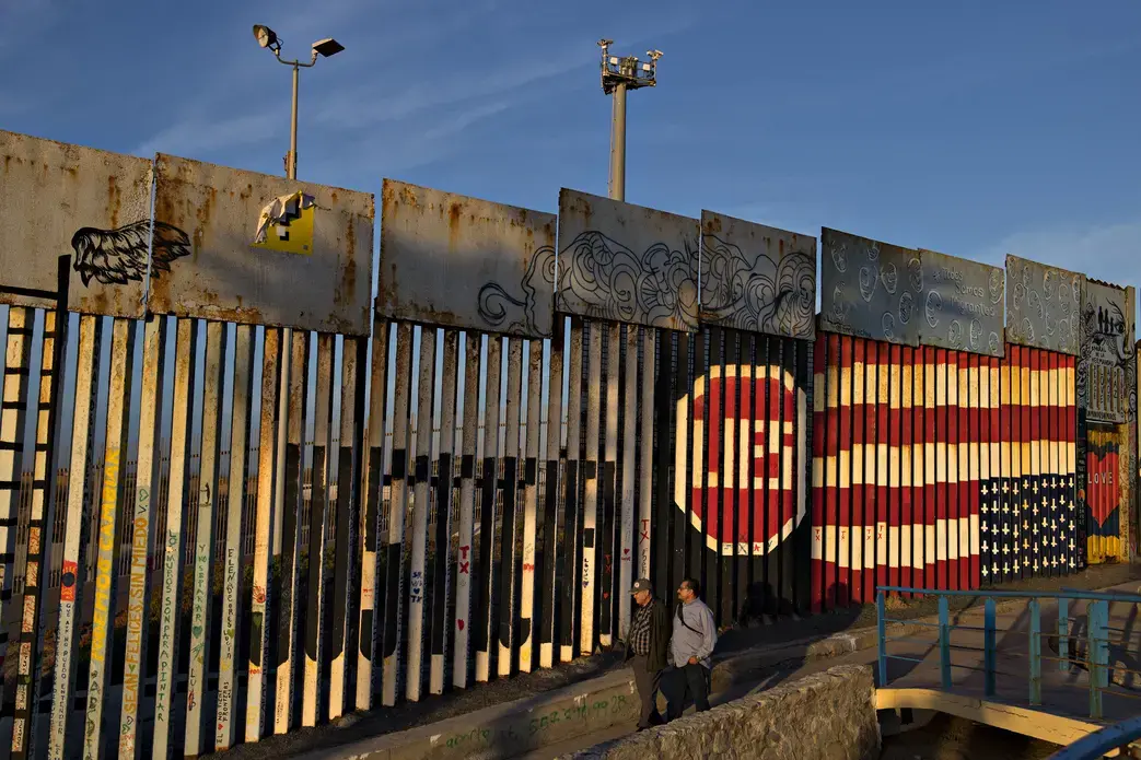 Visitors to Playas de Tijuana stop by the border wall at Friendship Park to look over artwork Dec. 1. Friendship Park is located along the United States-Mexico border in the San Diego-Tijuana region and is a half-acre in size. Image by Amanda Cowan. Mexico, 2019. Visitors to Playas de Tijuana stop by the border wall at Friendship Park to look over artwork Dec. 1. Friendship Park is located along the United States-Mexico border in the San Diego-Tijuana region and is a half-acre in size. Image by Amanda Cowan. Mexico, 2019.