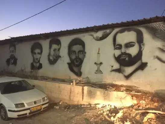 Murals of Palestinians killed by Israel decorate the walls around Qalandia village near the checkpoint. Image by Matt Kennard. West Bank, 2016. Murals of Palestinians killed by Israel decorate the walls around Qalandia village near the checkpoint. Image by Matt Kennard. West Bank, 2016.