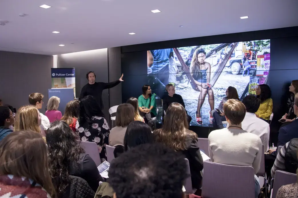 James Whitlow Delano presents an image of a 15-year-old widow from his Pulitzer Center-supported project on the Philippine drug war. Image by Jin Ding. United States, 2018.