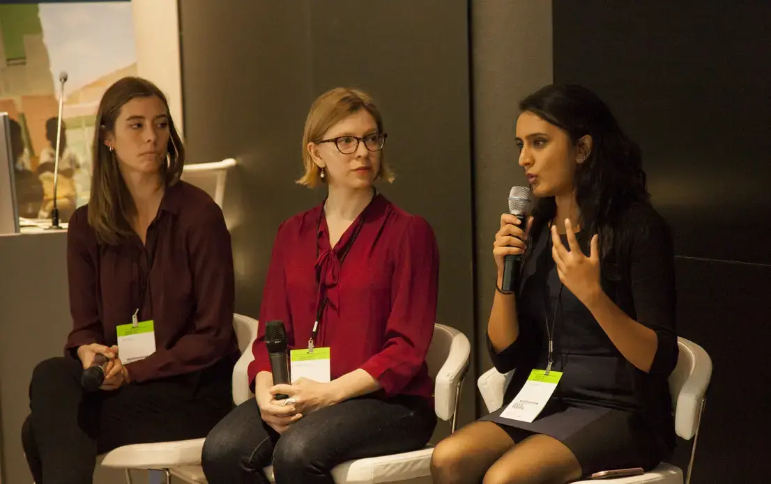 Student Fellow team, Thea Piltzecker and Liz Scherffius (Columbia University Graduate School of Journalism) listening to Divya Mishra (Johns Hopkins Bloomberg School of Public Health) during the Q&A for The Refugee Experience Panel at 2018 Washington Weekend. Image by Jin Ding. United States, 2018. Student Fellow team, Thea Piltzecker and Liz Scherffius (Columbia University Graduate School of Journalism) listening to Divya Mishra (Johns Hopkins Bloomberg School of Public Health) during the Q&A for The Refugee Experience Panel at 2018 Washington Weekend. Image by Jin Ding. United States, 2018.