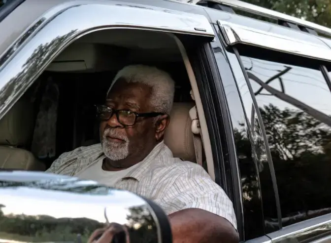 Pepper Holder sit in his SUV in front of one of the entrances to the old Koppers Tie Plant in Carbondale, Illinois on August 24, 2020. Image by Amelia Blakely. United States, 2020. Pepper Holder sit in his SUV in front of one of the entrances to the old Koppers Tie Plant in Carbondale, Illinois on August 24, 2020. Image by Amelia Blakely. United States, 2020.