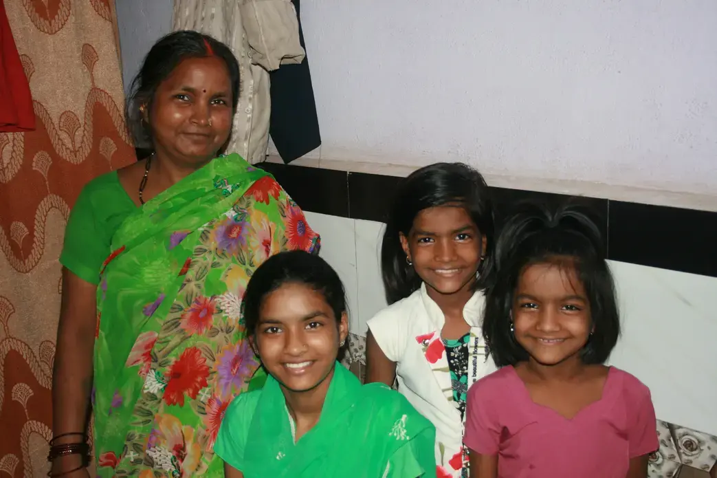 Rima Prajapati with daughters (from left) Jhoti, Aarti and Sangeeta. Jhoti and Aarti were both born deaf. Rima moved her daughters from their village to Mumbai so they could attend a school for the deaf. Image by Kate Petcosky-Kulkarni. India, 2016. Rima Prajapati with daughters (from left) Jhoti, Aarti and Sangeeta. Jhoti and Aarti were both born deaf. Rima moved her daughters from their village to Mumbai so they could attend a school for the deaf. Image by Kate Petcosky-Kulkarni. India, 2016.